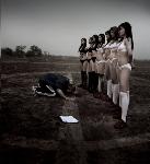 asian-coach-kneel-before-women-soccer-team.jpg